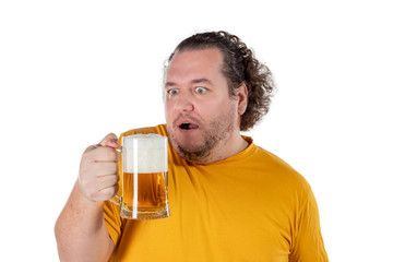 Fototapeta premium Funny fat man feeling happy and relaxed, holding fresh cold beer in his hands on white background