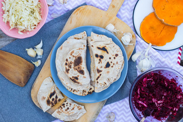 Hot chapati naan bread stuffed with sweet pumpkin. Indian traditional paratha. Food made of whole wheat and fried on dry pan or skillet. Vegan vegetarian healthy food. Flatbread roti.