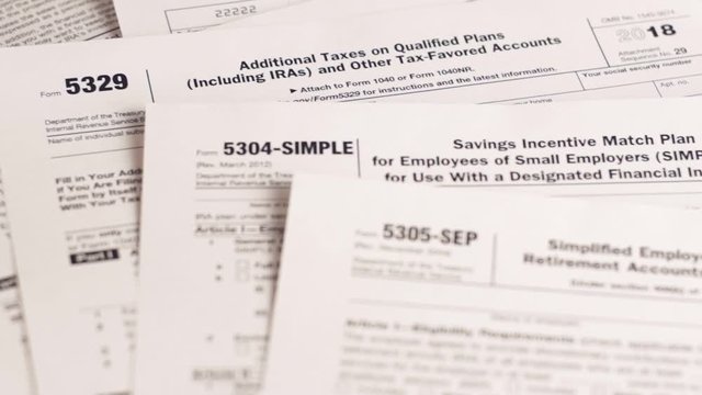 Tax forms 5329, 5304-simple, 5305-ser and personal plan 401k . Close-up