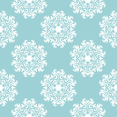 Floral seamless pattern. White on blue. Textile background