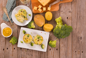 Potato gratins with broccoli florets.