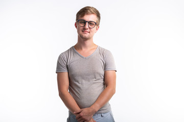 Geek, education, people concept - young man over the white background looks like he is a nerd