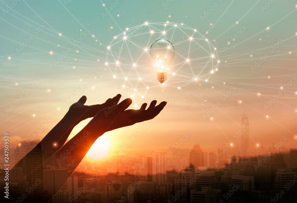 Aufkleber Abstract science. Hand holding brain digital network and light bulb inside on networking connection in the city background. Idea and imagination. Creative and inspiration. Innovation technology .