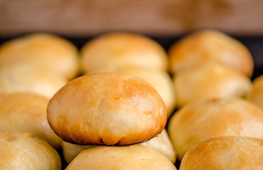 Potato pies on a baking sheet