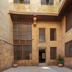 Facade of ottoman era historic house of Moustafa Gaafar Al Seleehdar, located at Al Darb Al Asfar District, Cairo, Egypt, with interleaved wooden windows (Mashrabiya)
