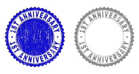 1ST ANNIVERSARY stamp seals with grunge texture in blue and grey colors isolated on white background. Vector rubber imitation of 1ST ANNIVERSARY title inside round rosette.