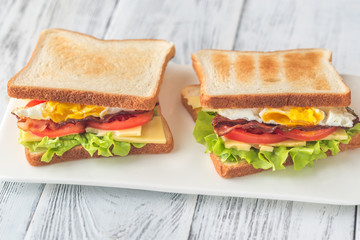 Sandwiches with fried egg and bacon