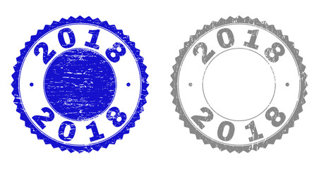2018 stamp seals with distress texture in blue and grey colors isolated on white background. Vector rubber imprint of 2018 text inside round rosette. Stamp seals with retro textures.