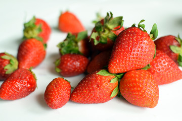 Fresh strawberries on on white background. Village strawberry close up.