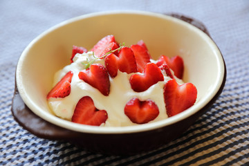 Strawberry with cream on table dessert