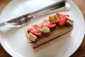 Strawberry cake dessert sweet food with strawberry nuts amd cake on wooden table