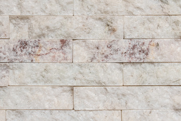 pared o muro de piedra blanca clara con textura tipo marmol close up