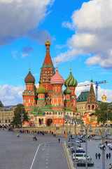 Obraz premium View of St. Basil's Cathedral on Red Square against blue sky with clouds in sunny day