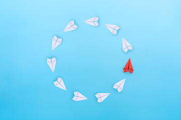 Business for new ideas creativity, innovative and solution concept. Group of paper planes in one direction with one individual is different on blue background.