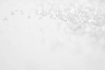 White crystals and soft bokeh abstract background with space for your text.