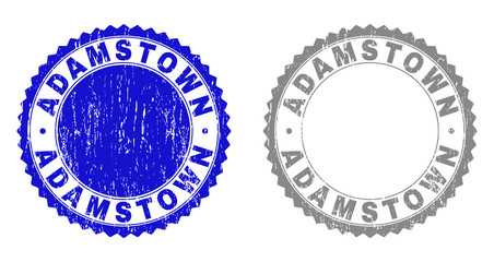 ADAMSTOWN stamp seals with distress texture in blue and grey colors isolated on white background. Vector rubber imitation of ADAMSTOWN label inside round rosette. Stamp seals with dust textures.