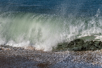 Splashing Atlantic ocean wave, Nazare, Portugal.