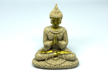Obraz premium Buddha figure meditating on a white background