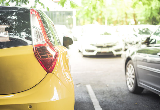 Yellow Car In The Car Park,Background Of Cars In Car Parking Lot