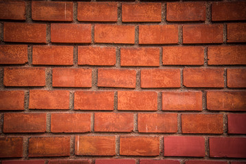 Fototapeta premium Szczegół tło z czerwonej cegły ściany z ciemnej winiety w rogach