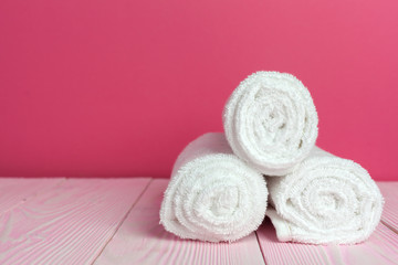 Fototapeta na wymiar Clean soft towels on wooden table