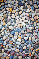 Colorful stones on the beach sand, nature art wallpaper background