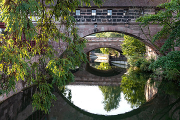View of the bridge in the form of a building on the Pegnitz River in Nuremberg Germany.