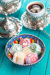 Traditional turkish coffee and turkish delight on wooden background.