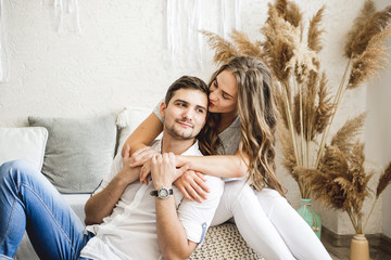 Lovers hug each other in the large bedroom. Love story. © sushytska