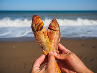 Fototapeta na wymiar Dried fish right on the beach
