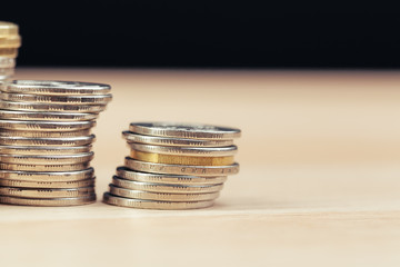 piles of coins on working table