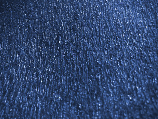 beautiful texture emboss blurred background of close up foam sheet in dark blue color, plastic foam sheet background dark blue color, focus and blurred texture background dark blue color