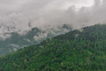 mountain range view. Timelapse Of Moving Clouds And Fog over Himalayan mountain range in Sainj