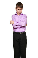 Fototapeta premium Boy posing on white background, black trousers and purple shirt