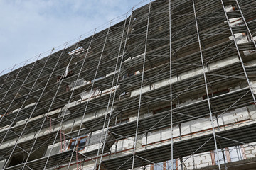 new building under construction, scaffolding and concrete