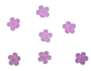 Pink fabric flowers on white background
