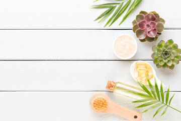 Beauty and fashion concept with spa set on pastel rustic wooden background.