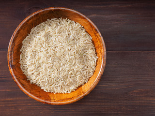 Rice in bowls on a brown background