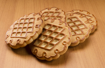 Five cookies closeup on wooden background