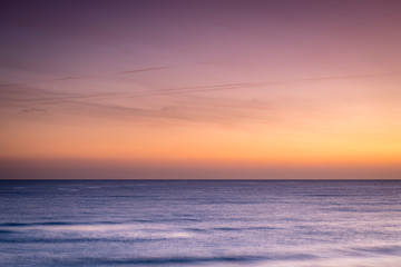 Fototapeta na wymiar golden and pink skies over the mediterranean sea near valencia