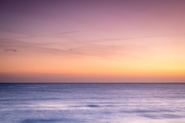 Fototapeta na wymiar golden and pink skies over the mediterranean sea near valencia