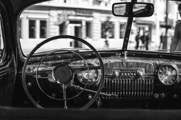 Fototapeta premium Retro car, retro torpedo car, vintage steering wheel, speedometer, recorder, clock, wooden,