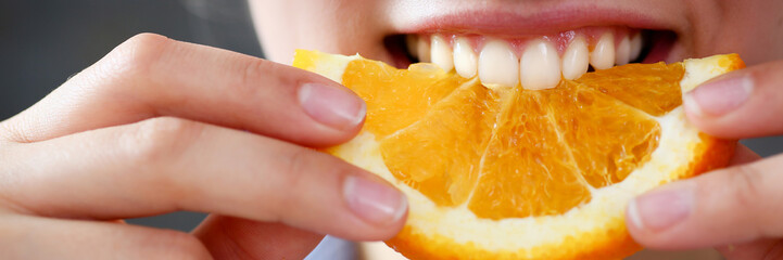 Woman portrait holds in her hand a slice of chopped