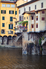 Fototapeta na wymiar Stone bridge Ponte Vecchio and the Arno river in Florence, Tuscany, Italy. Firenze landmarks.