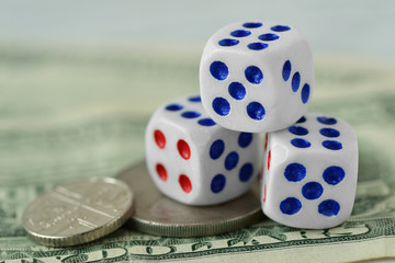 Dices on dollar money background - Concept of risky investments and gamble