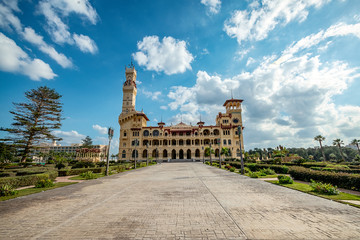 .Royal Palace of the 1930s in Turkish and Florentine styles in a palm park on a sunny day.