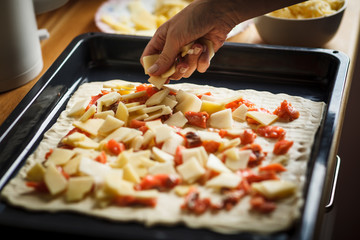 woman prepearing homemade fish pie with popato