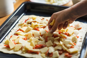 woman prepearing homemade fish pie with popato