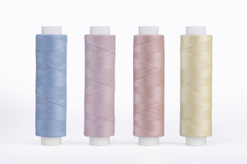 Set of sewing thread coils, miscellaneous colours, isolated on white