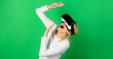 Woman watching virtual reality vision. Woman using VR device. Digital VR.